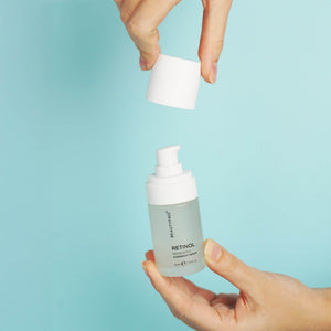 Hand holding BEAUTYPRO Retinol Overnight Serum pump bottle — daily retinol serum for skin renewal