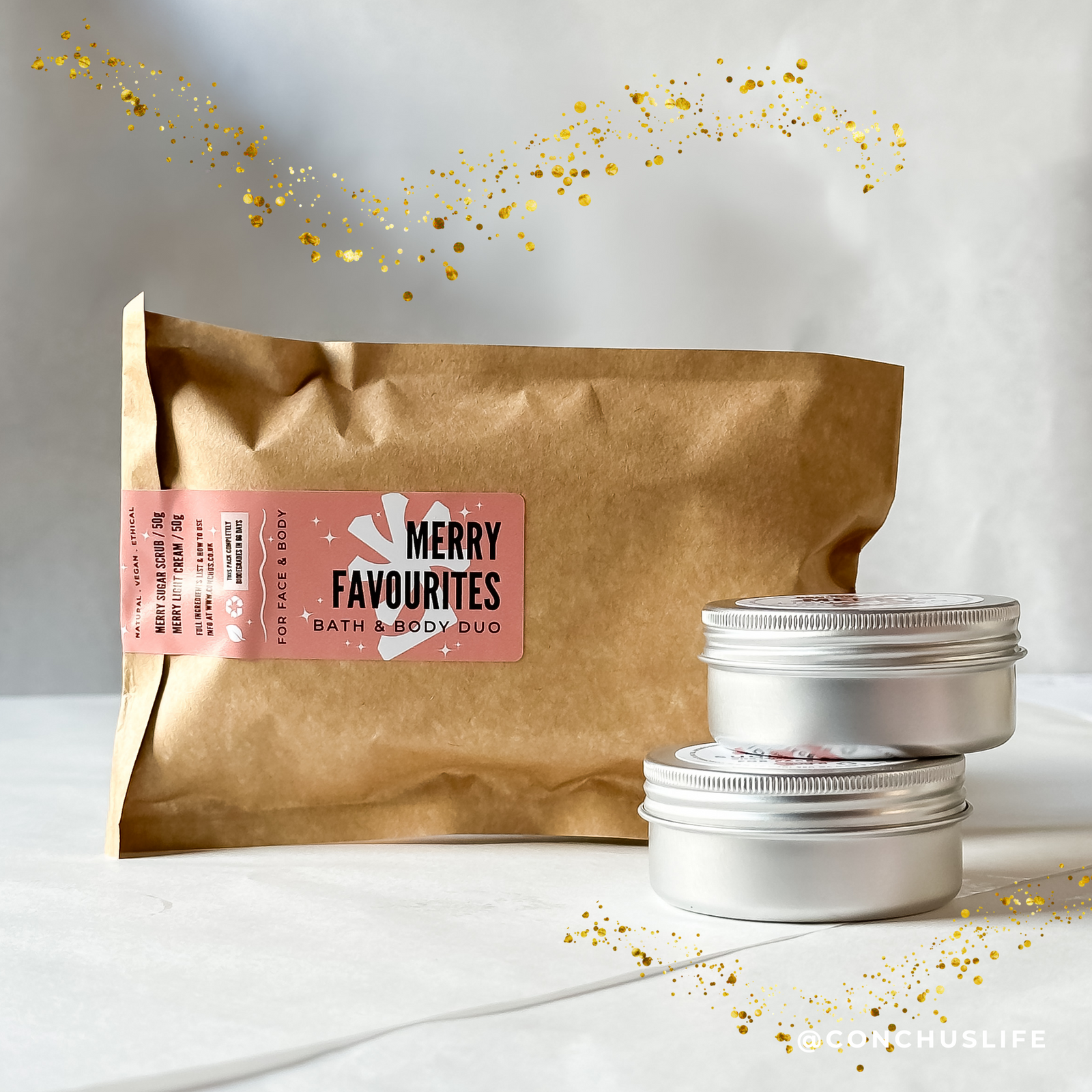 CONCHUS MERRY Bath & Body Duo with biodegradable pouch, Light Cream 50g and Sugar Scrub 50g displayed with festive botanicals